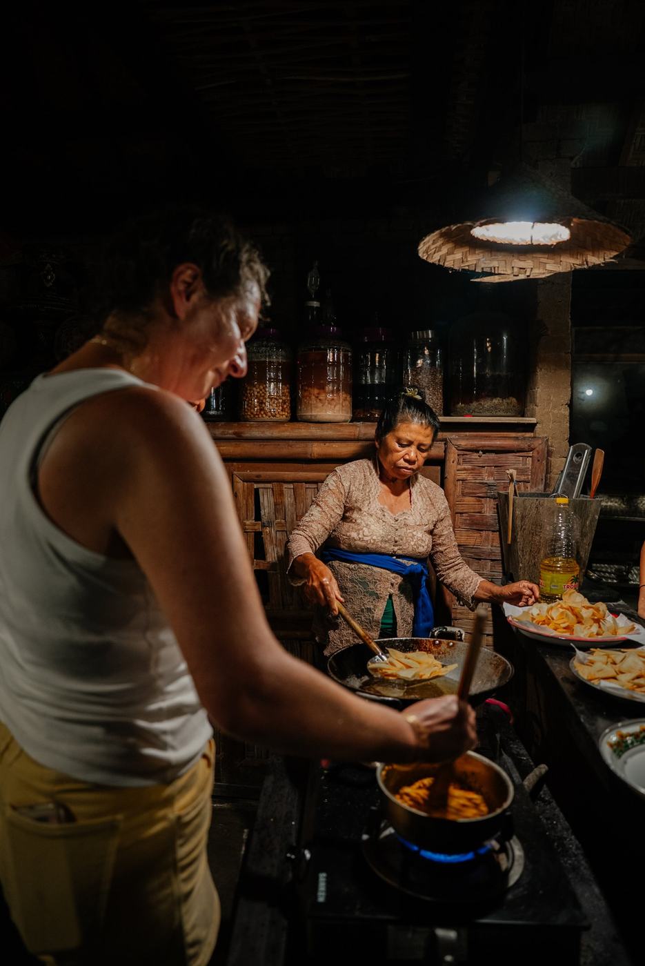 A host cooking over a wood fire