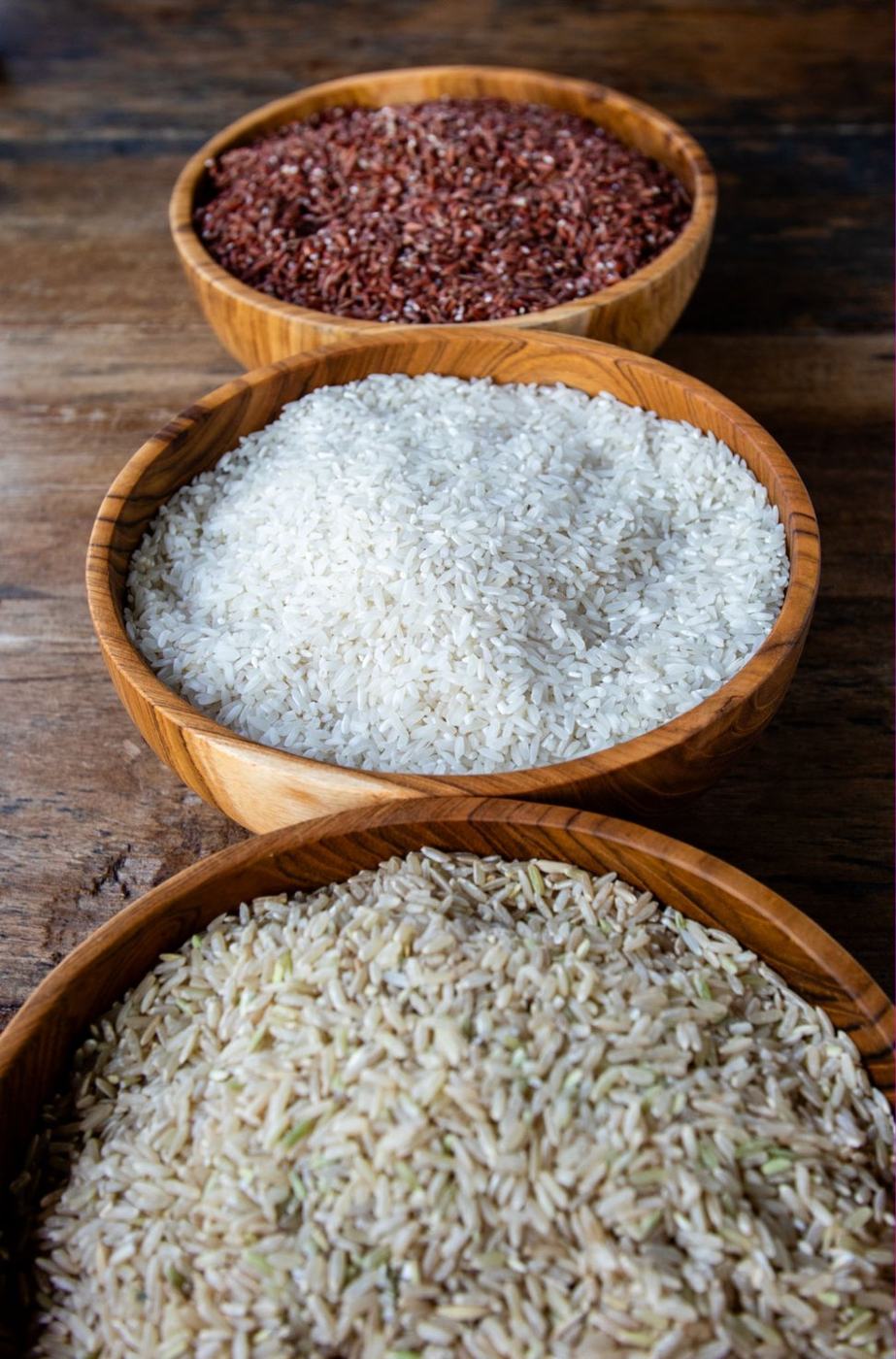 Bowls of white, red and brown regenerative rice