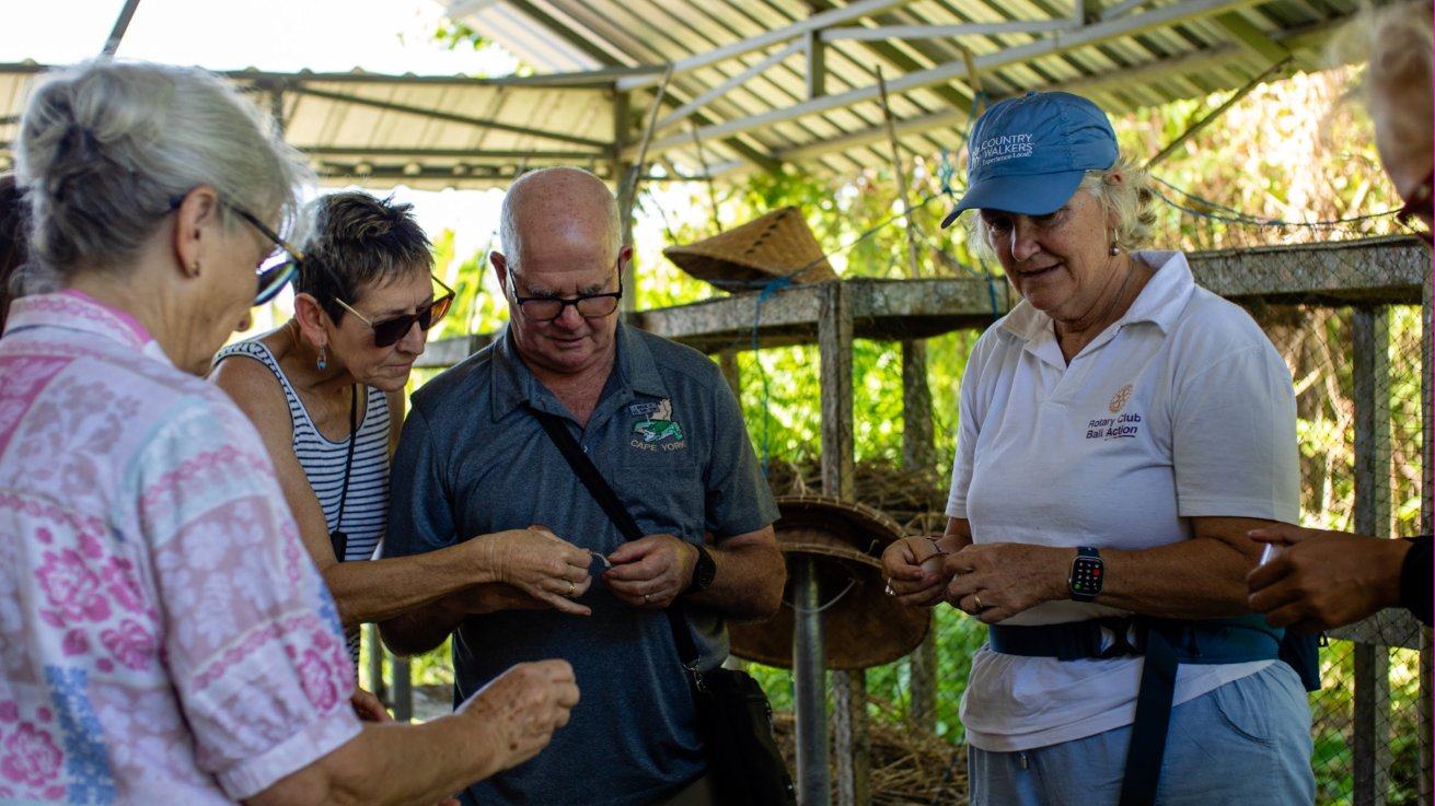 Visitors looking closely at what lives in our compost